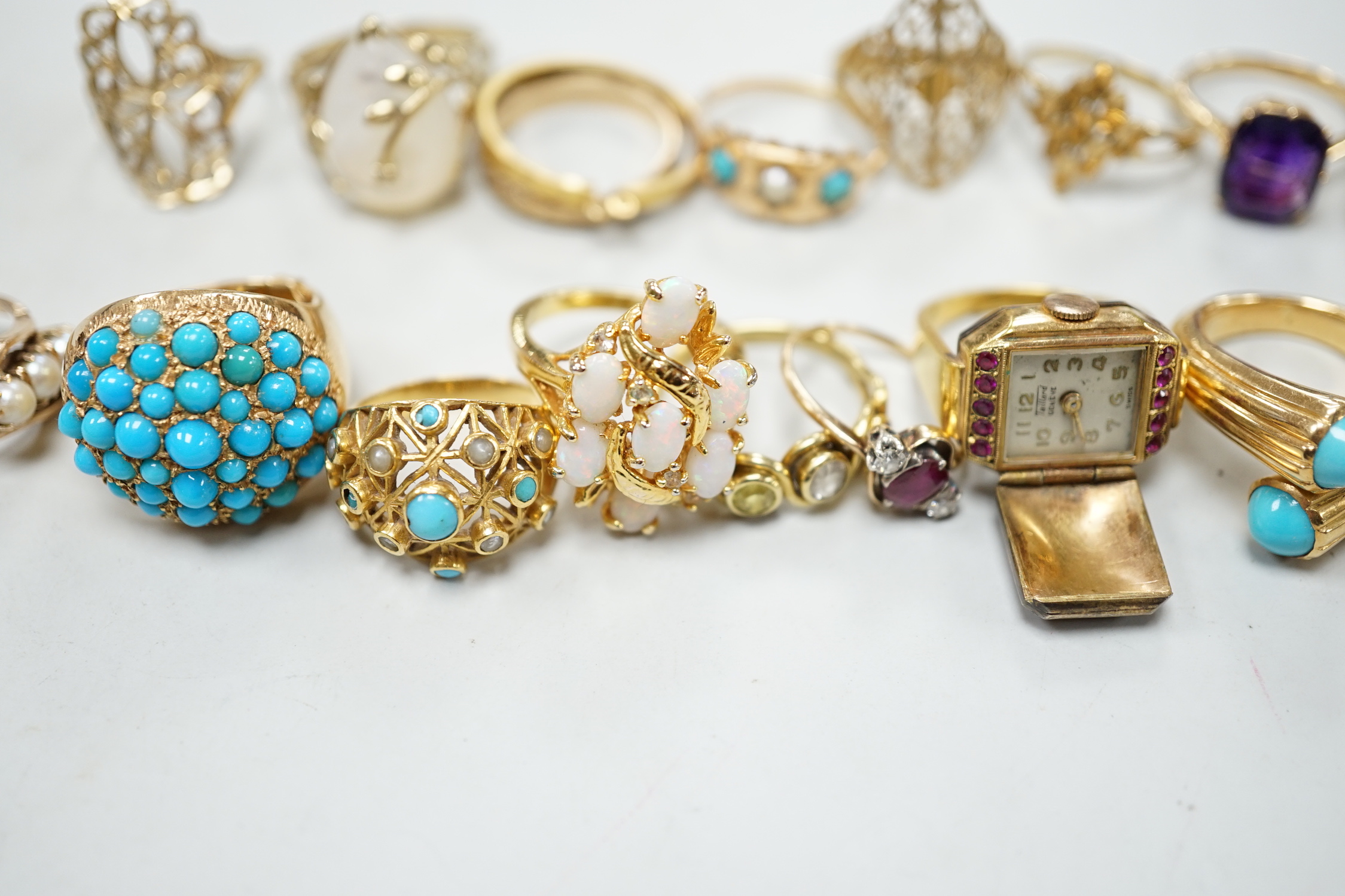 Three 18ct and gem set rings including star sapphire, turquoise and pearl and ruby and diamond three stone, five 9ct gold rings and a 9ct gold pendant mount and nine other rings including ring watch and Middle Eastern tu